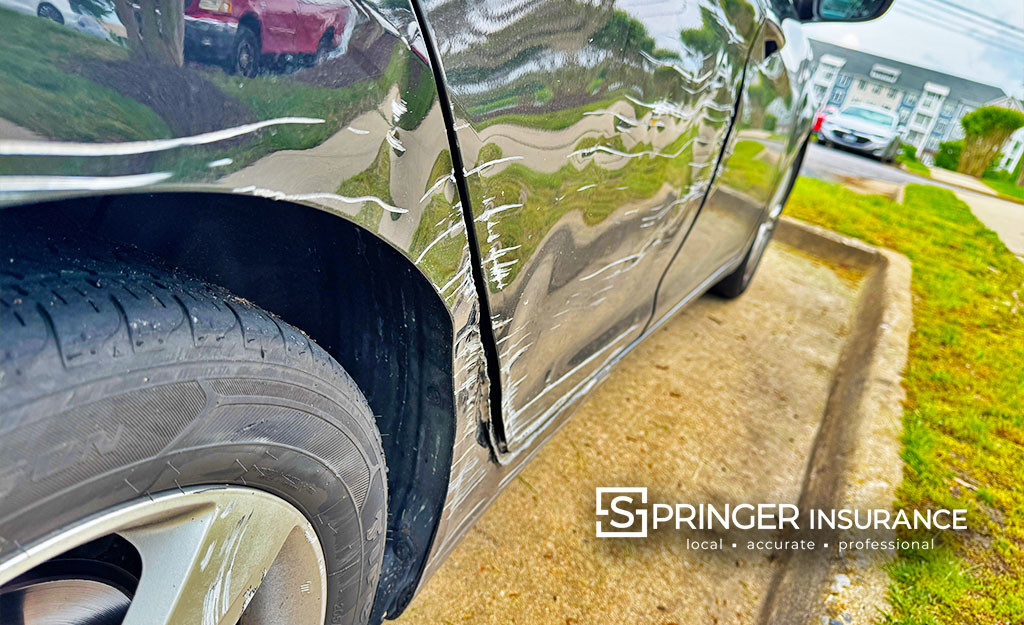 A car with scratches down the side